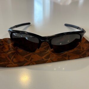 Oakley Glossy Black Wrap Sunglasses with Black Lenses